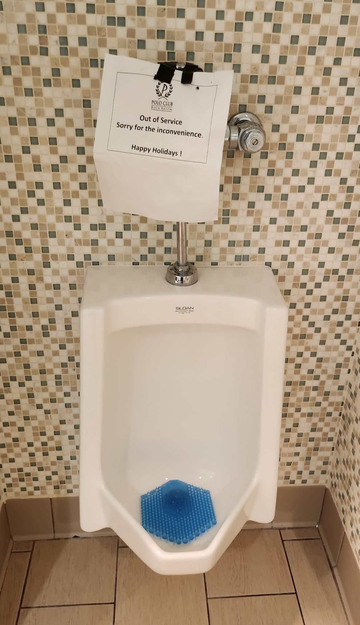 out of order clogged urinal